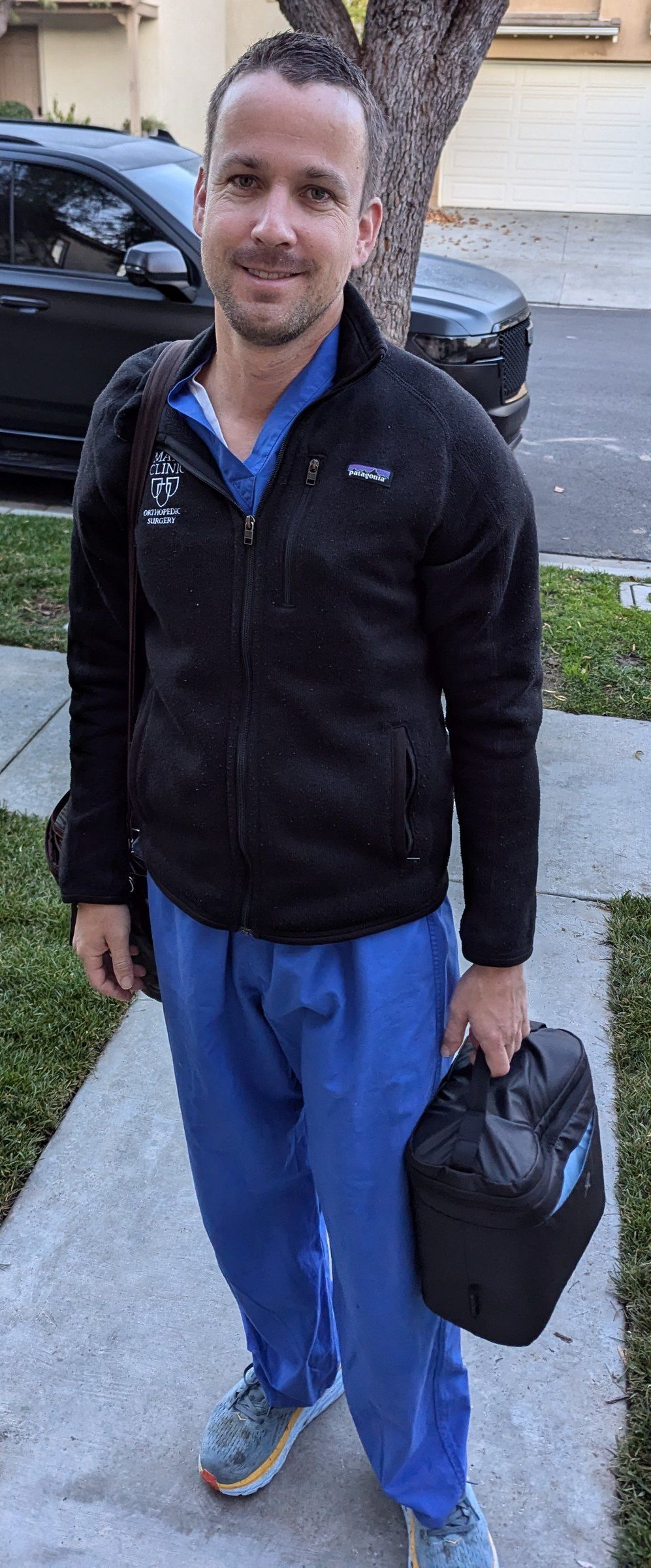 Matthew Siljander leaving for the hospital in scrubs on his last day of surgery